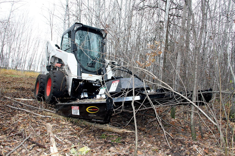 Heavy-duty skid rails allow mower to glide across ground and uneven terrain