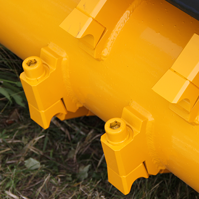 This Skid Steer Mulcher features reversible carbide teeth for double the tooth life